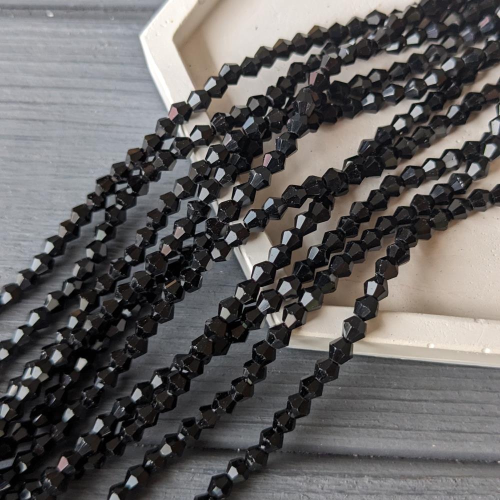 Čierna korálka s dvojitým kužeľom 4 mm, 85 korálok